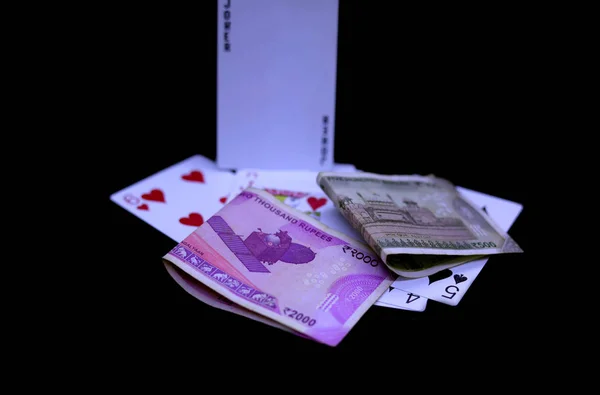 Indian rupee, playing cards on top a table — Stock Photo, Image