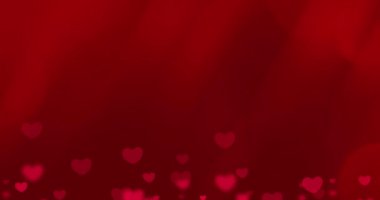 Kırmızı arkaplanda, sevgililer günü ve düğün konsepti için Bokeh efektleri olan animasyon kırmızı kalpler.
