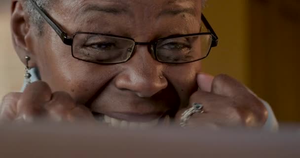 Excited happy smiling elderly black woman reacting to good news on her laptop — Stock Video