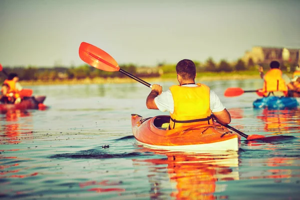 Kayaking and canoeing with family. Children on canoe. Family on kayak ride.