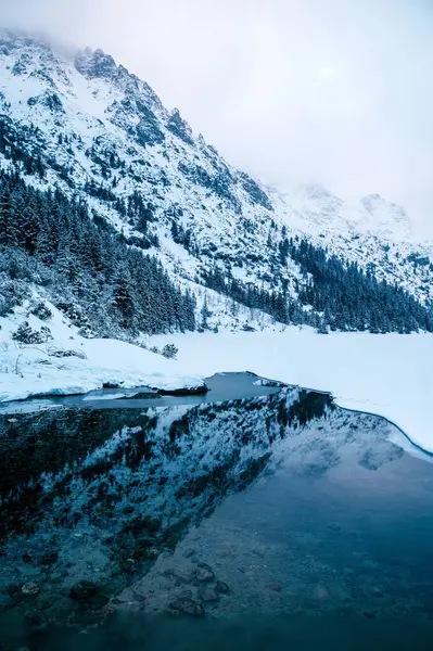 Morskie Oko Lake Sits Front Majestic Snowy Mountain Range Creating Royalty Free Stock Images