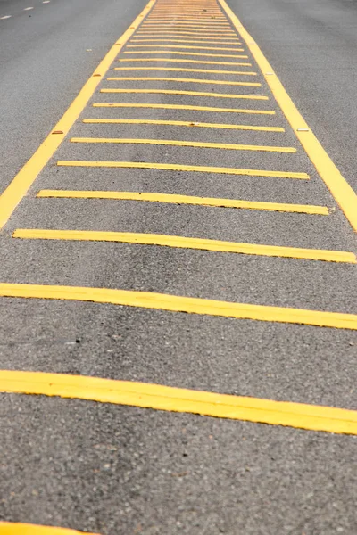 Yellow color road line on asphalt background
