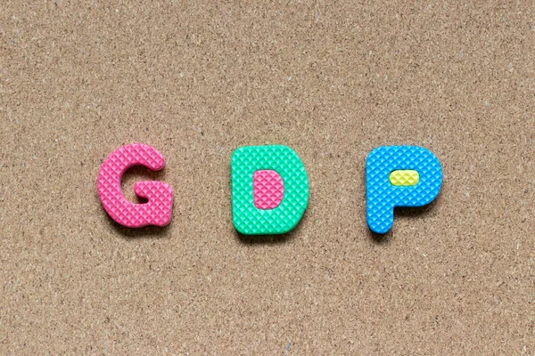 Color foam alphabet in word GDP (Gross domestic product or Good distribution practice) on cork board background