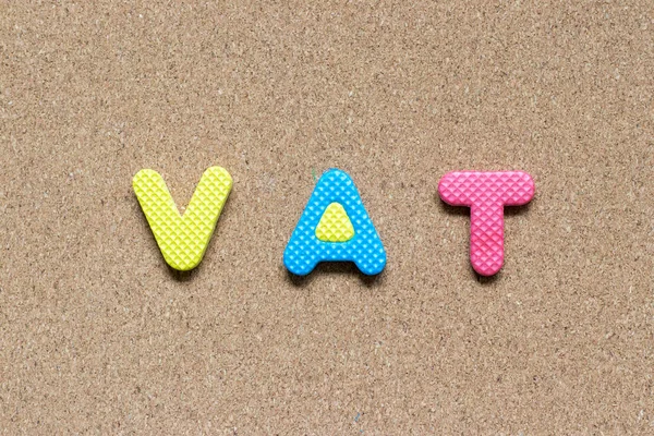 Color foam alphabet in word vat (abbreviation of value added tax) on cork board background