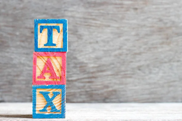 Farbe Buchstabenblock Wort Steuer Auf Holz Hintergrund — Stockfoto