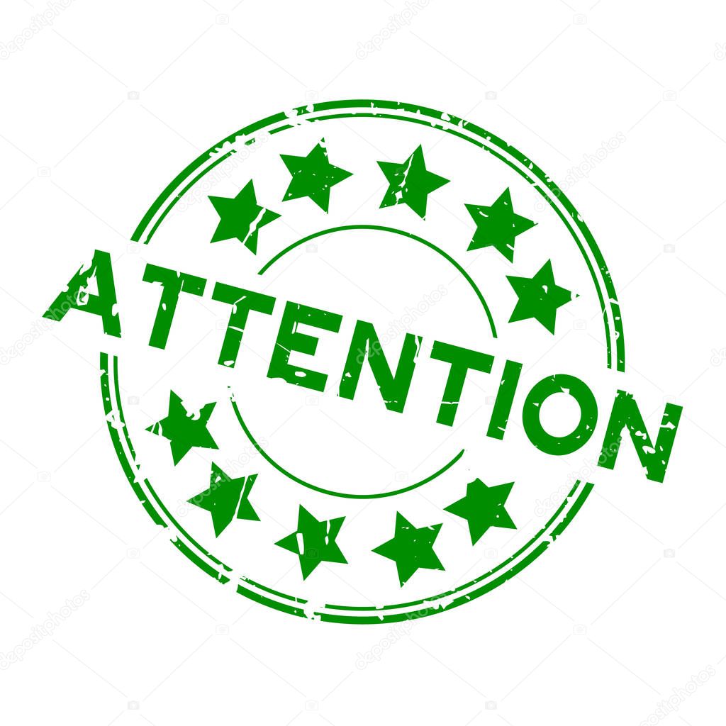Grunge green attention with star icon round rubber stamp on white background