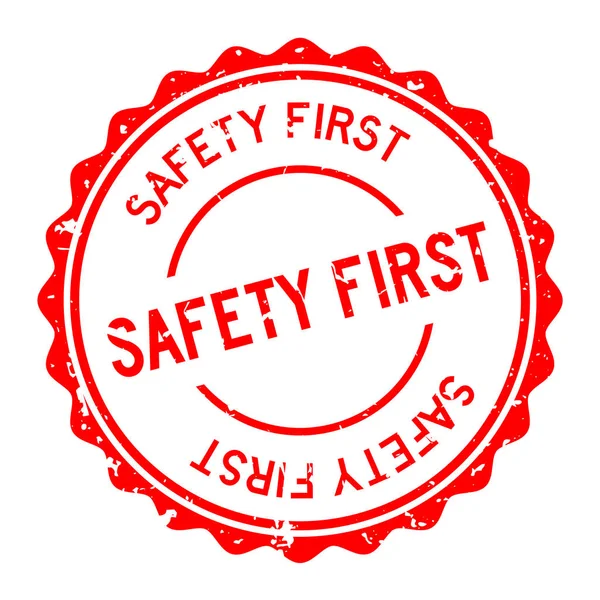 白色背景的红色安全第一个字圆形橡胶印章邮票 — 图库矢量图片