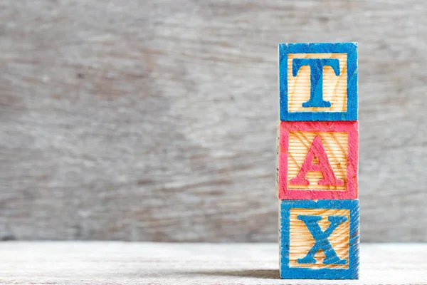 Farbe Buchstabenblock Wort Steuer Auf Holz Hintergrund — Stockfoto