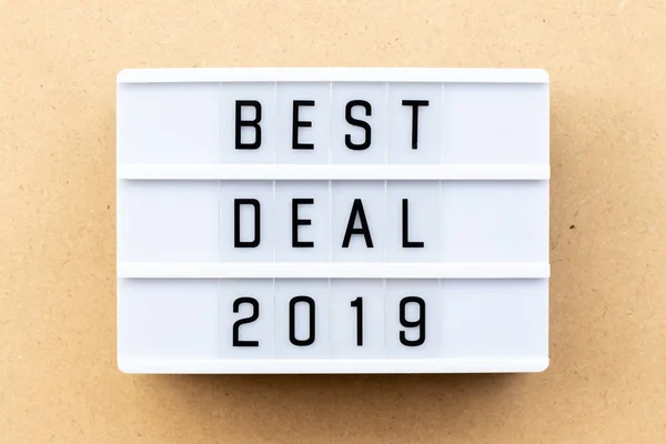Light box with word best deal 2019 on wood background