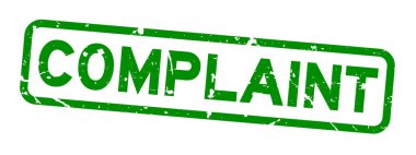 Grunge yeşil şikayet kelime Meydanı lastik mühür damgası beyaz arka plan üzerinde