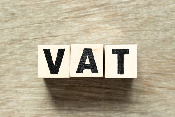 Letter block in word VAT (value added tax) on wood background