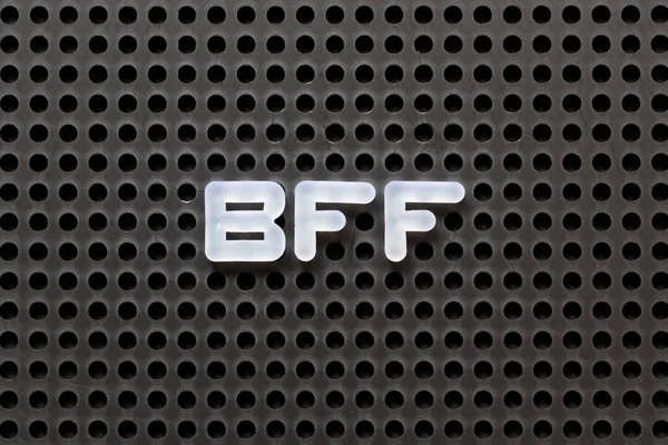 Black color pegboard with white letter in word BFF (Abbreviation of best friend forever)