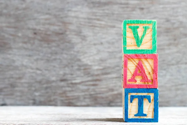 Color letter block in word vat (abbreviation of value added tax)  on wood background