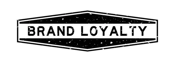 Черный фирменный знак лояльности слово шестиугольная резиновая печать на белом фоне — стоковый вектор