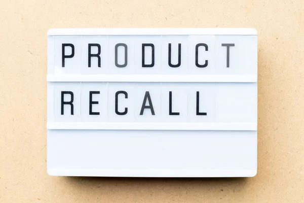 White lightbox with word product recall on wood background — Stock Photo, Image
