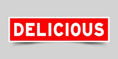 Gri arka planda kelime lezzetli ile kare kırmızı renk etiket