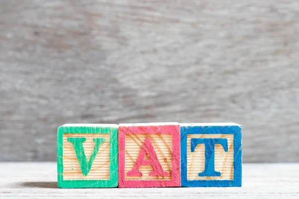 Color letter block in word vat (abbreviation of value added tax) on wood background