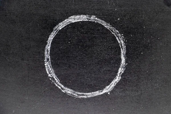 White chalk drawing as circle shape on black board background — Stock Photo, Image