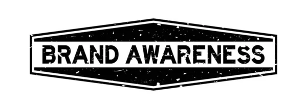 Grunge Black Brand Awareness Wort Sechseck Gummidichtung Stempel auf weißem Hintergrund — Stockvektor