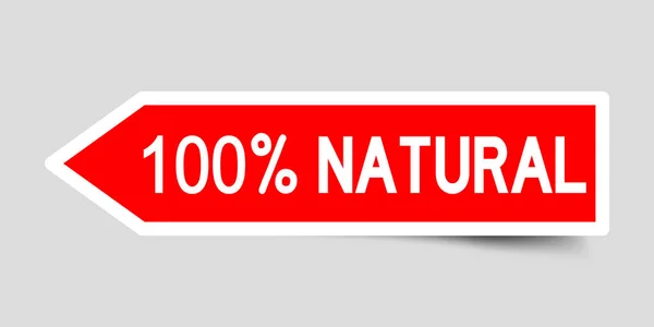 Adesivo in forma di freccia di colore rosso con la parola 100% naturale su sfondo grigio — Vettoriale Stock
