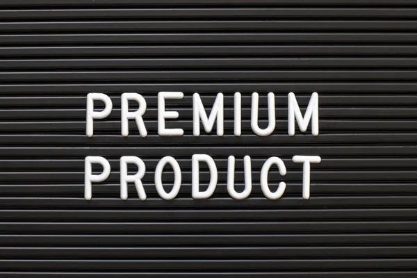 Black color felt letter board with white alphabet in word premium product background
