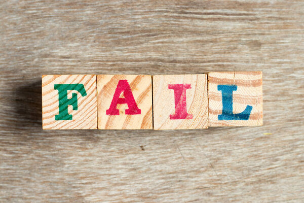 Letter block in word fail on wood background