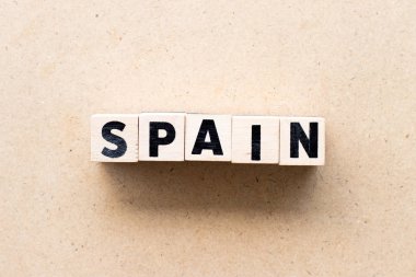 Ahşap arka planda kelime İspanya Harf bloğu