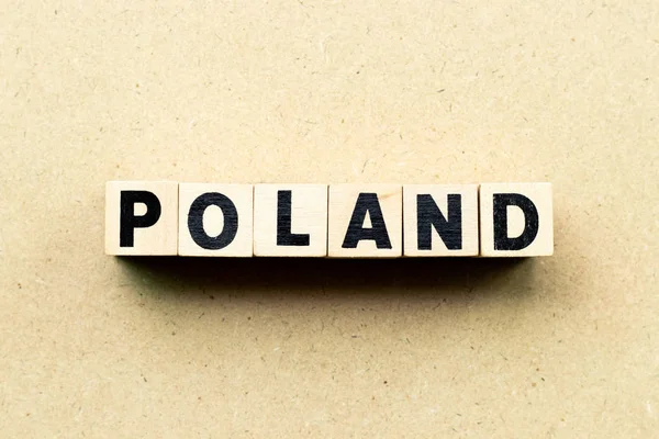 Blok literowy w słowie Polska na tle drewna — Zdjęcie stockowe