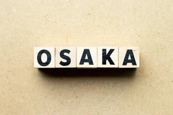 Letra Bloque Palabra Osaka Sobre Fondo Madera —  Fotos de Stock