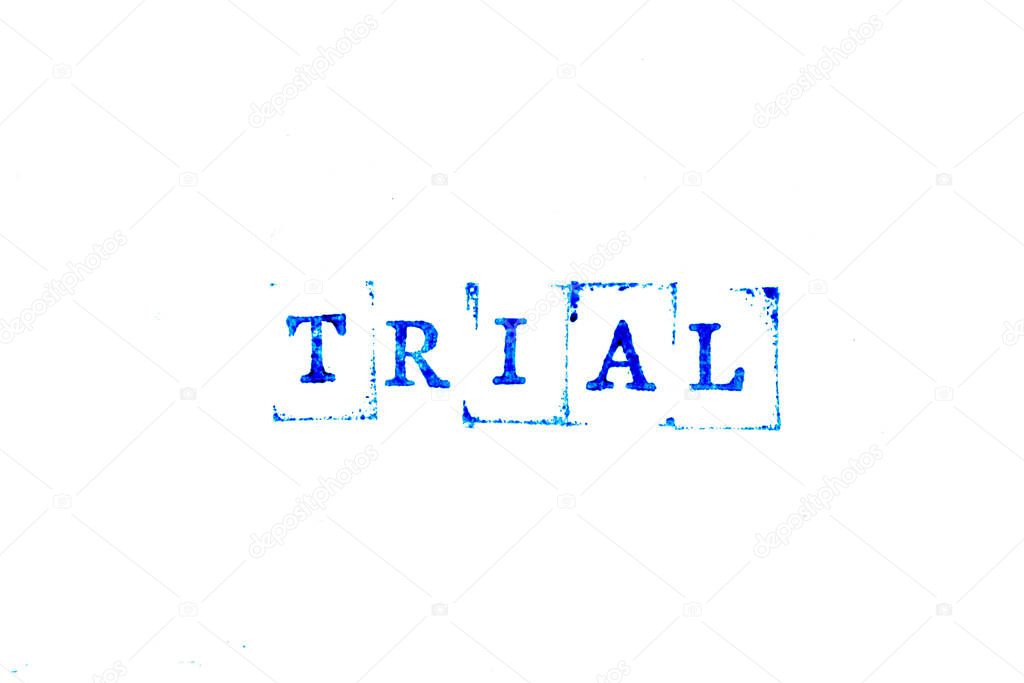 Blue ink of rubber stamp in word trial on white paper background