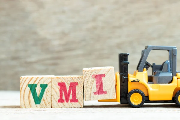 Spielzeuggabelstapler Halten Buchstabenblock Das Wort Vmi Abkürzung Für Vendor Managed — Stockfoto