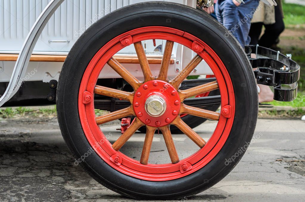LVIV, UKRAINE - JUNE 2018: Wooden wheel of an old vintage retro Buick car