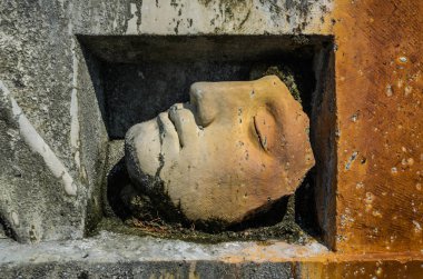 ROMA, ITALY - AUGUST 2018: Antique monument with body parts at Villa D'Este in Tivoli, Italy clipart