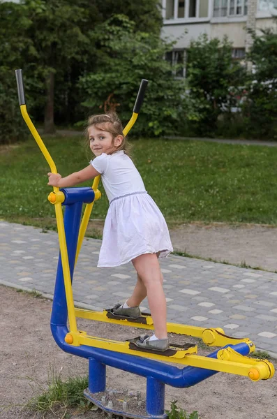Little Beautiful Girl Child Engaged Simulators Playground Fitness Street — Stock Photo, Image