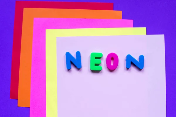 Neon word on multicolored background in trendy colors. — Stock Photo, Image