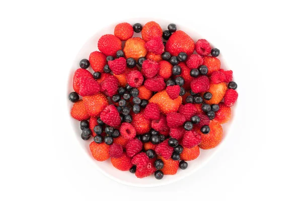 Fresh strawberries, raspberries, mountain ash in a plate on a light background. — Stock Photo, Image