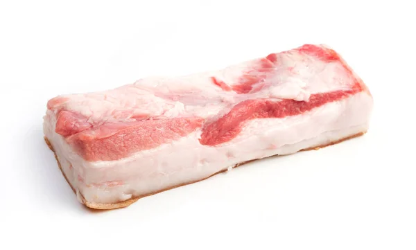 Un gran corte de carne con manteca de cerdo sobre un fondo blanco aislado. — Foto de Stock