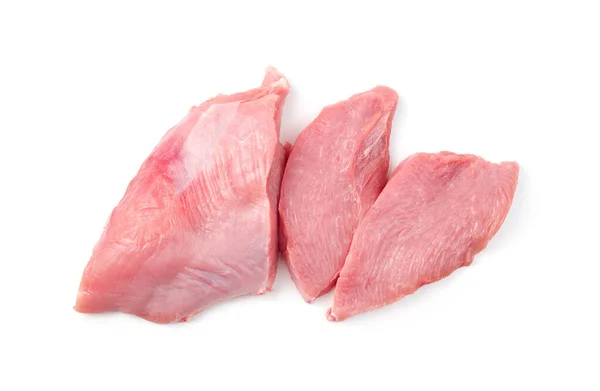 Carne de peru em um fundo branco, grande parte e pequenos bifes. — Fotografia de Stock