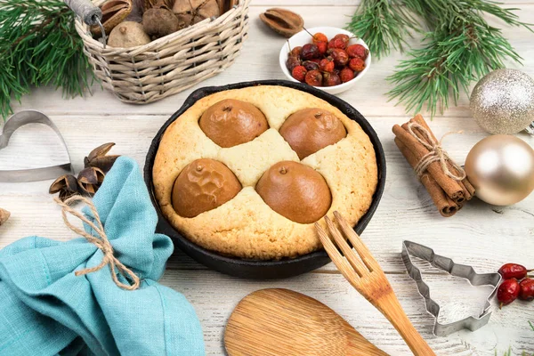 Happy New year and merry Christmas, festive background with cake, cooking utensils and fir decorations on wooden background. — Stock Photo, Image