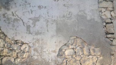 Güneşli bir günde eski taş duvar ve tuğla desenli arka plan