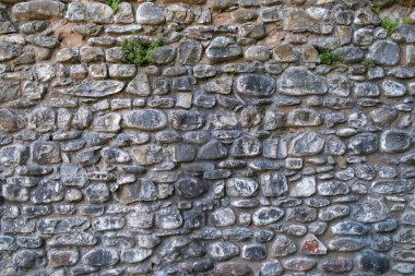 Güneşli bir günde eski taş duvar ve tuğla desenli arka plan