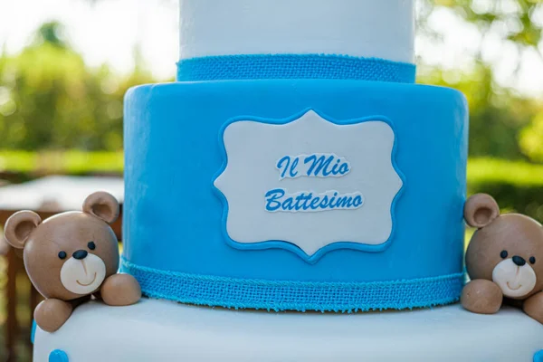 white and blue cake celebrating my baptism in sugar paste with teddy bear. High quality photo