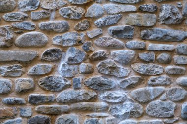 Güneşli bir günde eski taş duvar ve tuğla desenli arka plan