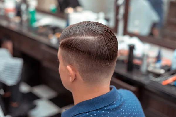 Men\'s haircut and styling in barbershop. Stylish Haircut Haircut.