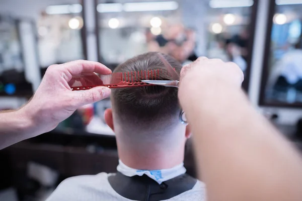 The customer receives services in the barbershop. Care for a haircut and a beard. — Stock Photo, Image