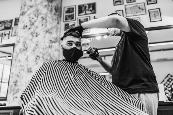 Haircut in quarantine. Haircut in masks from the virus. Hair and health care.