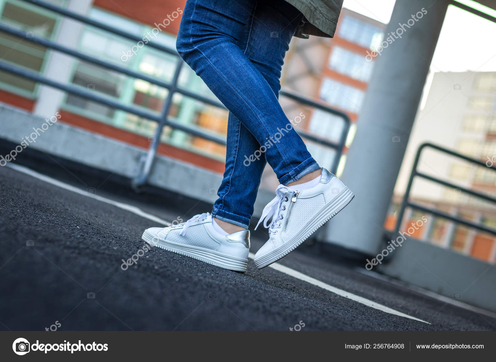 Woman White Sneakers City Female Legs Wearing Jeans Leather Sports Stock  Photo by ©encierro 256764908