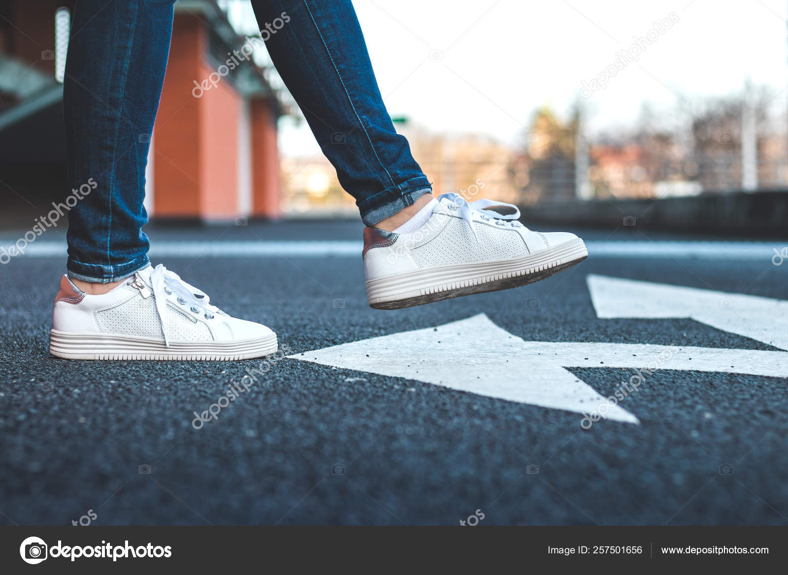 White Sneakers Asphalt Road Arrow Traffic Directional Sign Woman