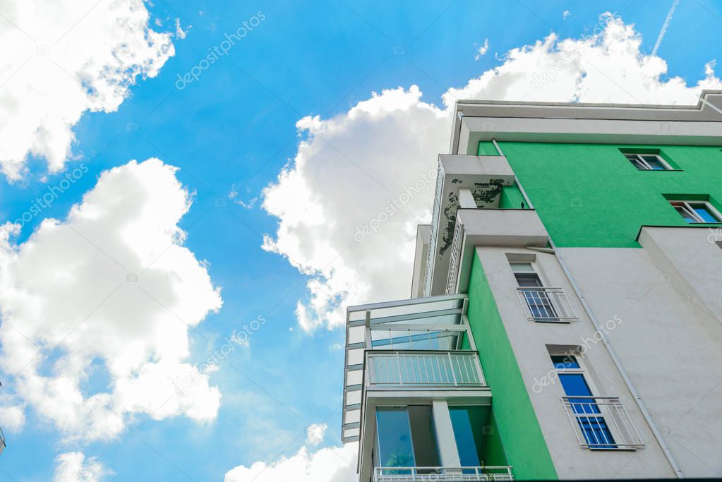 building facade blue sky with white clouds on background. real estate