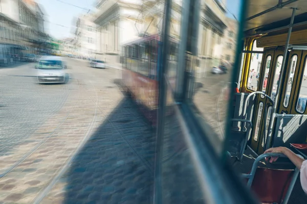 view from tram half inside half outside. old european city view. urban transportation